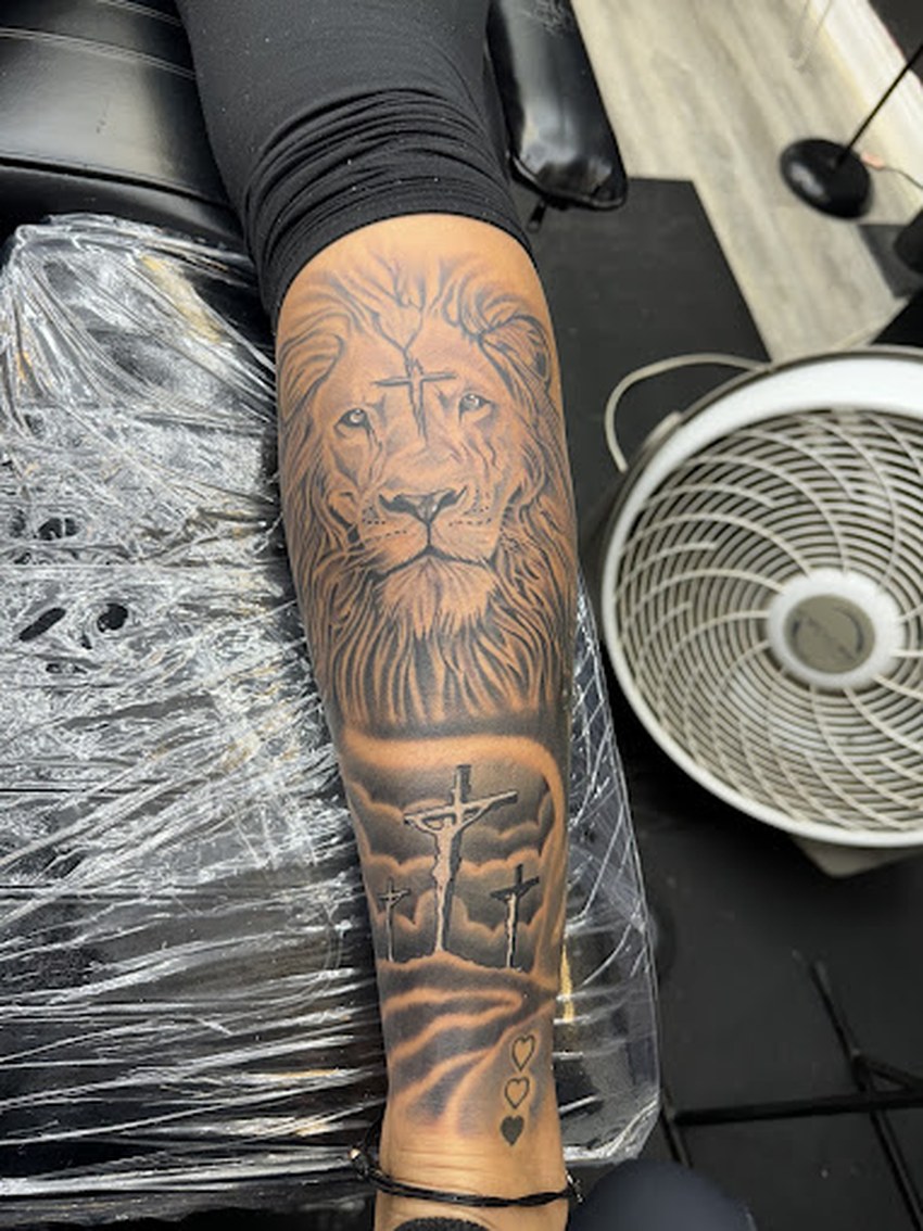 Lion and three crosses black and grey sleeve by Roberts Ink, Marion Ohio